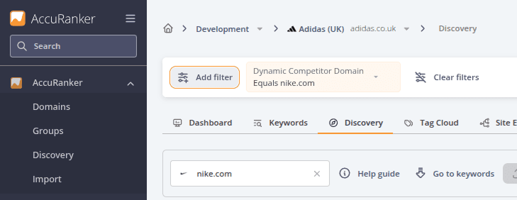 Discovery page with a Dynamic Competitor Domain filter applied to show keyword opportunities related to nike.com, and the Add filter button highlighted.